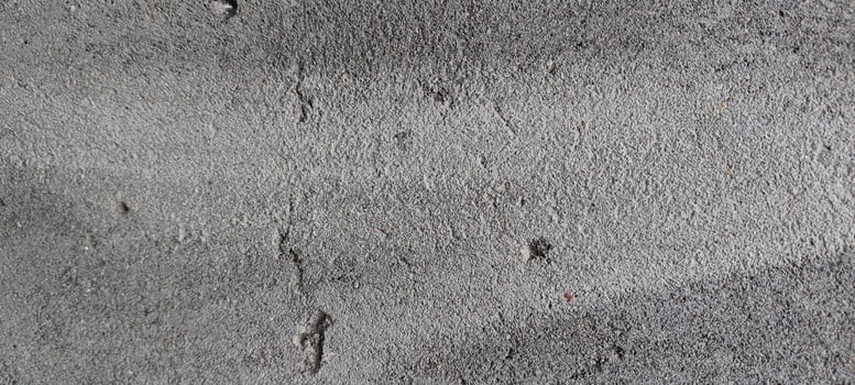 a close up of a concrete wall with some paint photo