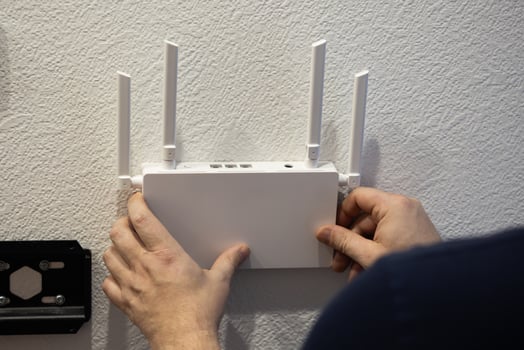 For optimal connectivity, installing a wireless router on the wall can enhance signal strength photo