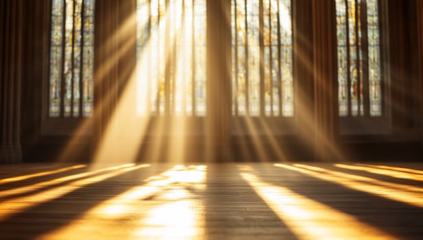 Sunlight streaming through stained glass windows, creating a serene atmosphere. photo