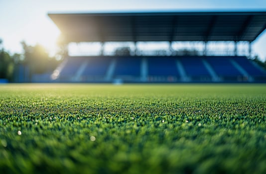 A local football field in a small town, with worn grass and rustic goalposts. A nostalgic and authentic sports setting, great for community football themes and grassroots sports visuals photo