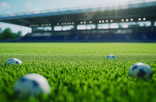 A close-up of a football resting on the field, with sharp white lines and textured grass. A powerful image symbolizing competition, passion, and the essence of the game. photo