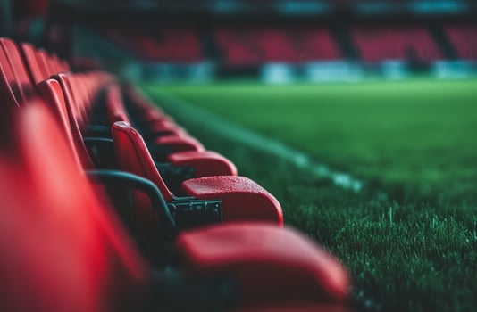 A well-maintained football field with bright stadium lights shining over the green turf. Ideal for sports photography, training visuals, and energetic football-themed projects. photo