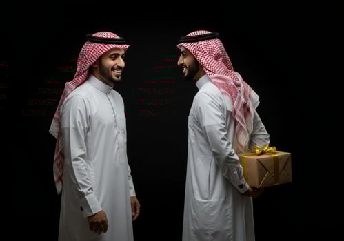Smiling Arab Men Exchange Gift Black Background photo