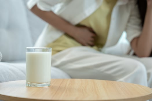 Milk allergens, Sick sad unhealthy ill allergic woman, runny stuffy sore nose suffer from intolerance allergy trigger symptoms. abdominal pain, allergens, nut protein rash, death, food allergy. photo