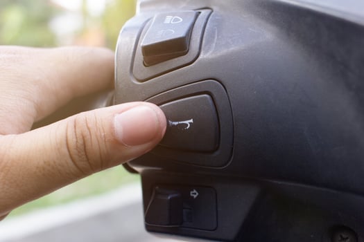 people press the motorbike horn button photo