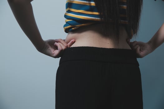 A woman with her hands on her hips photo