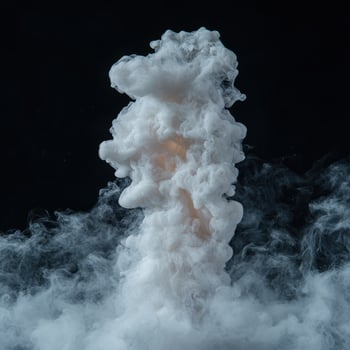 Dramatic cloud of white smoke against a black background photo