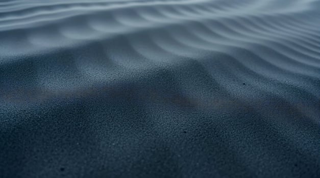 A close up of a black sand dune photo