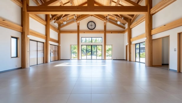 A large room with wooden beams and windows photo