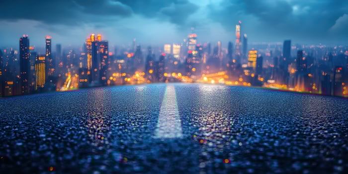 Vibrant city skyline illuminated at night with wet road reflecting bright lights photo