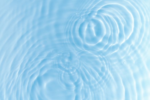 Summer Background,Water Waves Abstract Pattern Texture on Swimming pool,Top view Poolside with Light,Shadow on Blue water, Sea Blue Circle Surface with Ripples,Splashes with Sunlight photo