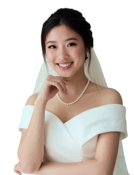 A woman in a wedding dress posing for a photo