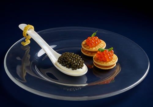 Elegant caviar and blini presentation. photo