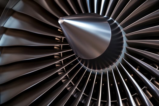 Close-up view of intricately designed jet engine blades shining under studio lighting photo