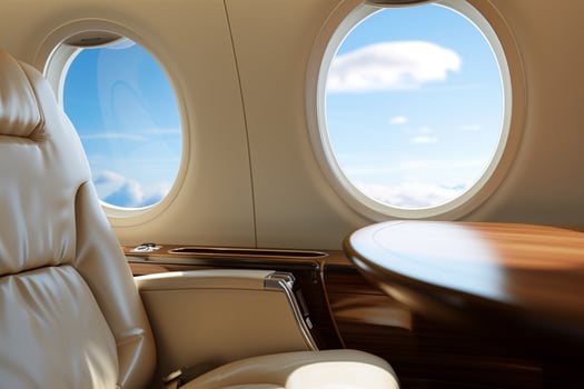 Glance inside a private jet with elegant leather seat and walnut table by the oval window photo