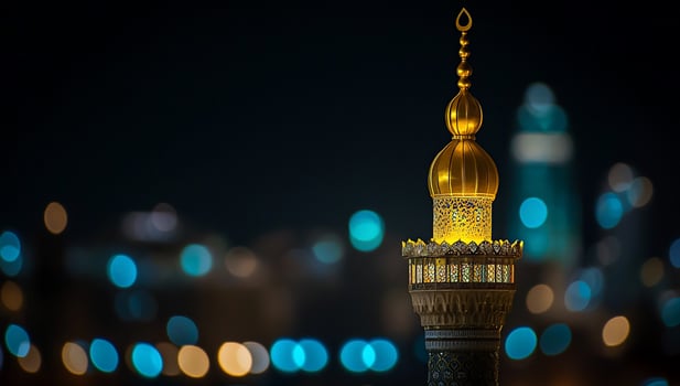 Night view of a mosque's golden dome and minaret illuminated. photo