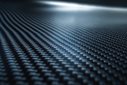 Abstract close-up of a textured surface with a mesmerizing wave pattern, showcasing shades of blue and silver. photo