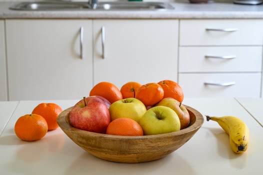 Cooking a healthy food or a breakfast. Fruits on the table and lunchbox. photo