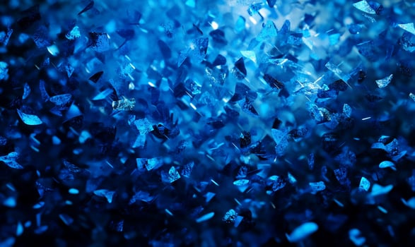 A close-up of shimmering blue crystals reflecting light. photo