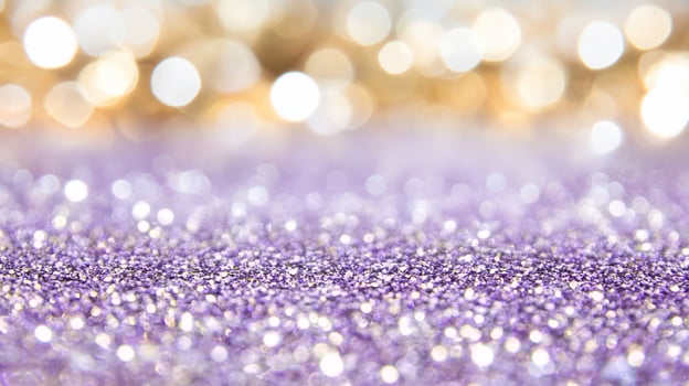A shimmering background of purple glitter with soft bokeh lights. photo