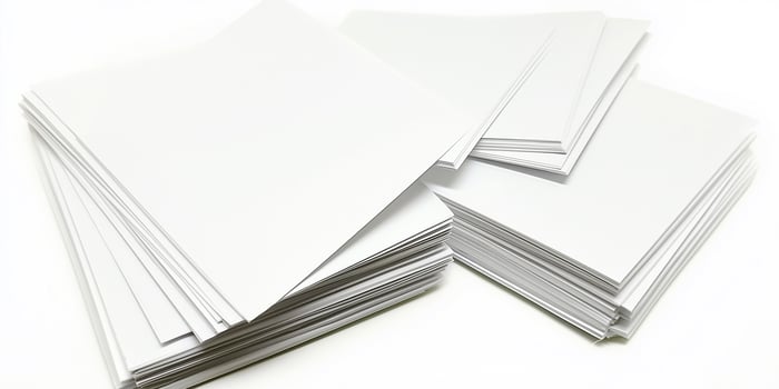 Blank paper cards stacked neatly on a white background for creative projects and notes photo