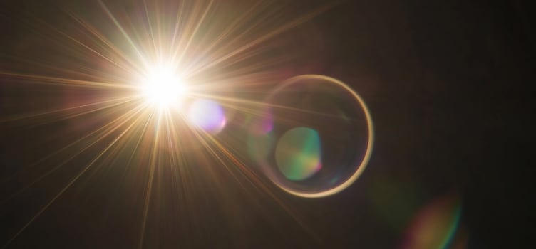 Bright light source with lens flare and colorful reflections. photo