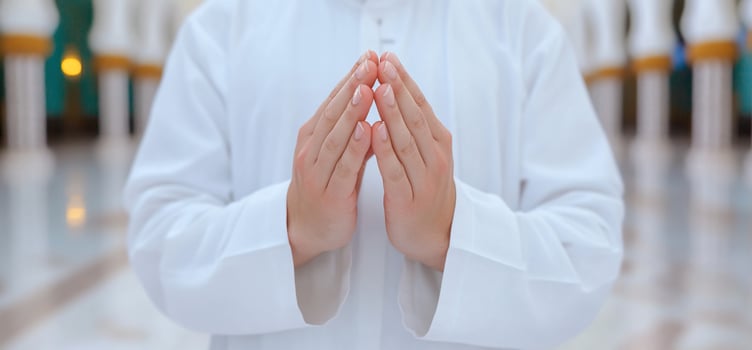Hands in a prayer position, symbolizing spirituality and reverence. photo