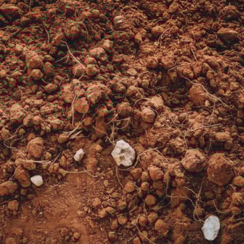A pile of dirt with some rocks and dirt photo