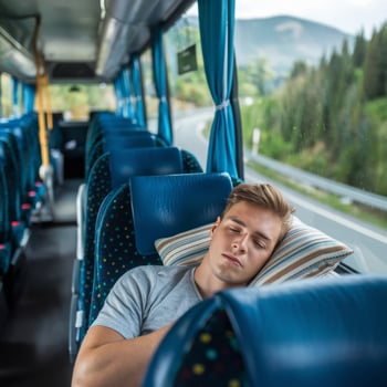 A man sleeping on a bus photo