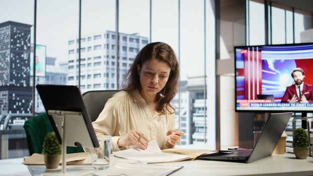 Female entrepreneur working on her legal obligations to sign paperwork and work contracts, approving all documents for performance and productivity. Businesswoman CEO gives authorizations. Camera B. photo