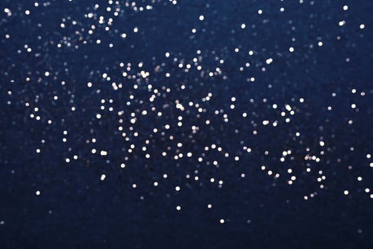 Festive Blue background of silver glitter lights. Winter blurred abstraction photo