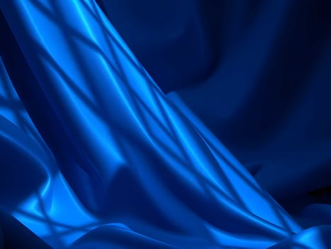 A blue silk fabric with a window in the background photo