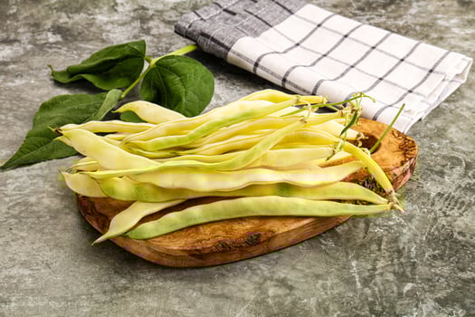 A bunch of beans on a wooden board photo