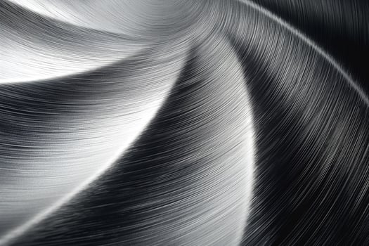Abstract silver metal surface showcasing intricate brushed patterns and light reflections. photo