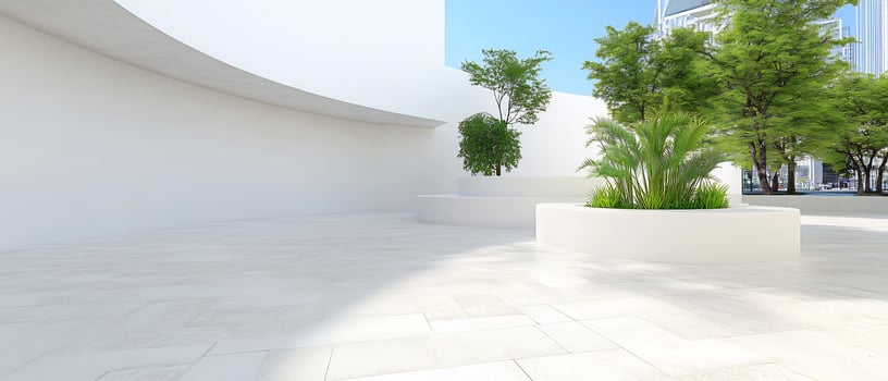 A white building with a large planter in the middle photo