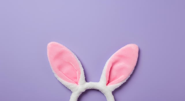 Minimalist Easter Bunny Ears on Soft purple for Spring. A trendy flat lay of rabbit ears, evoking a sense of freshness and seasonal joy, perfect for digital invitations, social posts photo