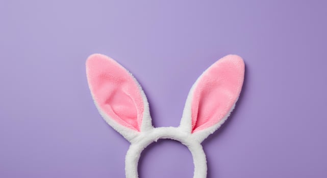 Happy Easter Rabbit Ears on a Light purple Background. A pastel Easter composition featuring bunny ears as a symbol of spring, renewal, and joy, great for festive designs and creative content photo