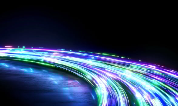 Neon light trails curve on dark ground, futuristic background, tech design photo