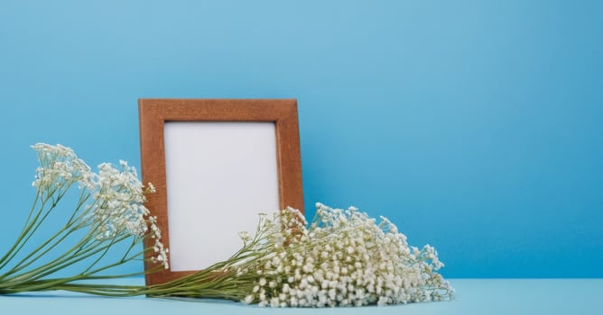 Blank photo frame on blue background