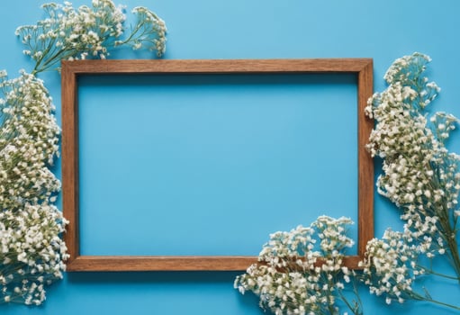 Frame with white flowers on blue background photo