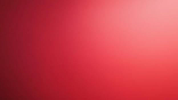 A gradient of deep red to lighter pink fills the frame, offering a visually calming and minimalist aesthetic. The color gradation is smooth. photo
