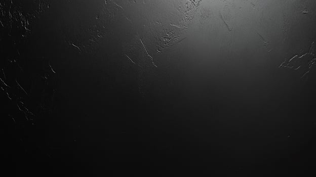 An abstract dark gray background featuring subtle textures and gradients, creating a dramatic and sophisticated visual effect for versatile use. photo
