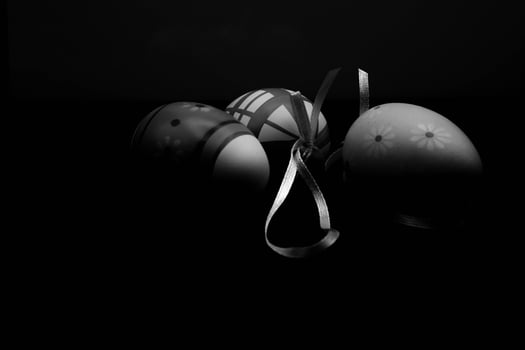 colored easter eggs on black background for holy easter photo