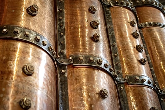 Copper stills gleaming in a distillery, brewing spirits photo