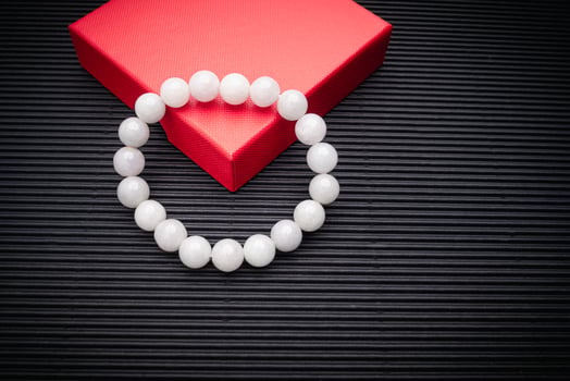 White jade bangle or bracelet on a black background. photo
