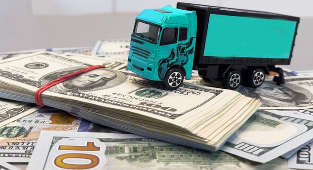 a toy truck is on the banknotes photo