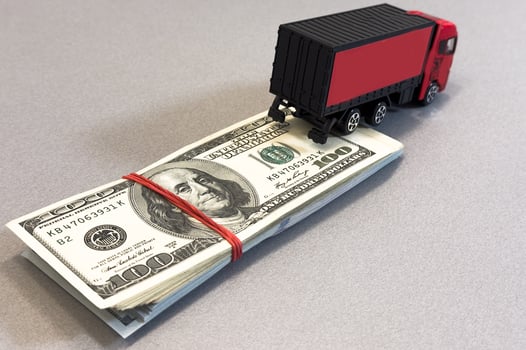 a toy truck is on the banknotes photo