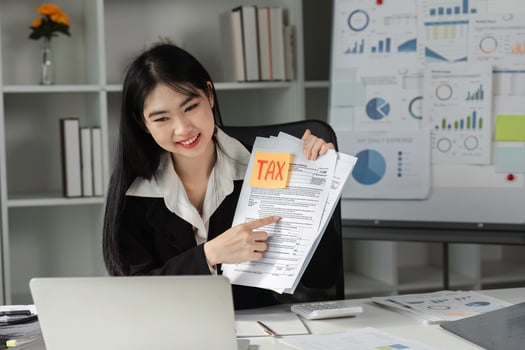 Accountant presenting tax documents, highlighting key financial information. photo