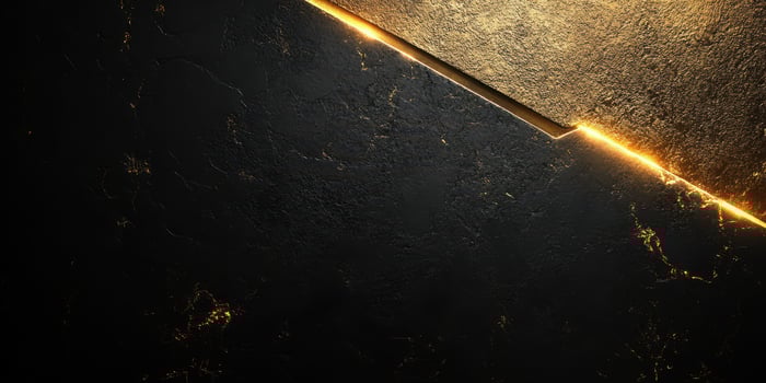 Elegant golden light contrast on textured black surface creates a striking visual effect in an artistic design photo