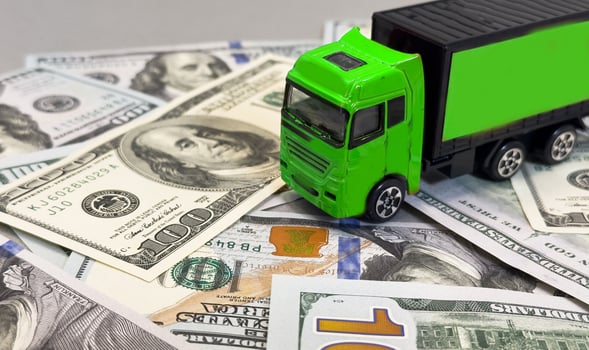 toy truck lie on dollars, space for text. photo